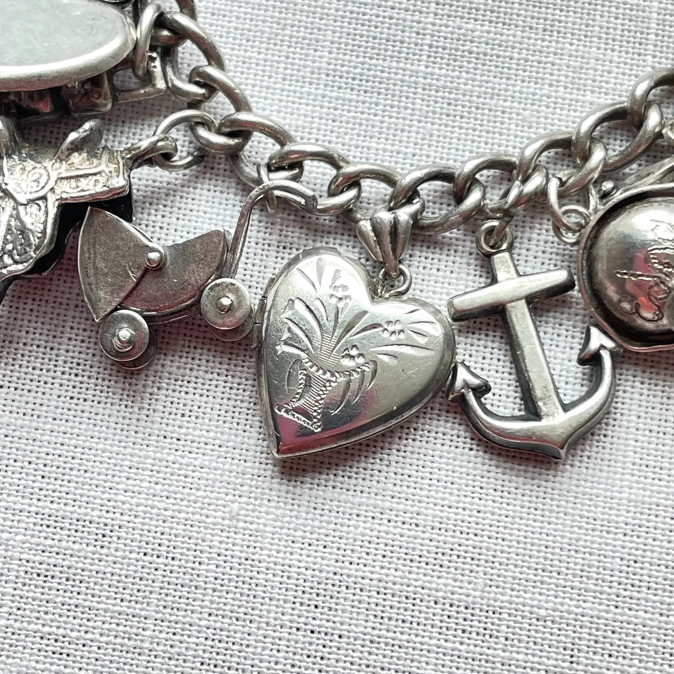 SOLD Vintage 40s WWII Sterling Charm Bracelet, Puffy Hearts/Southwestern/Calif/Military Sweethearts 22 Charms