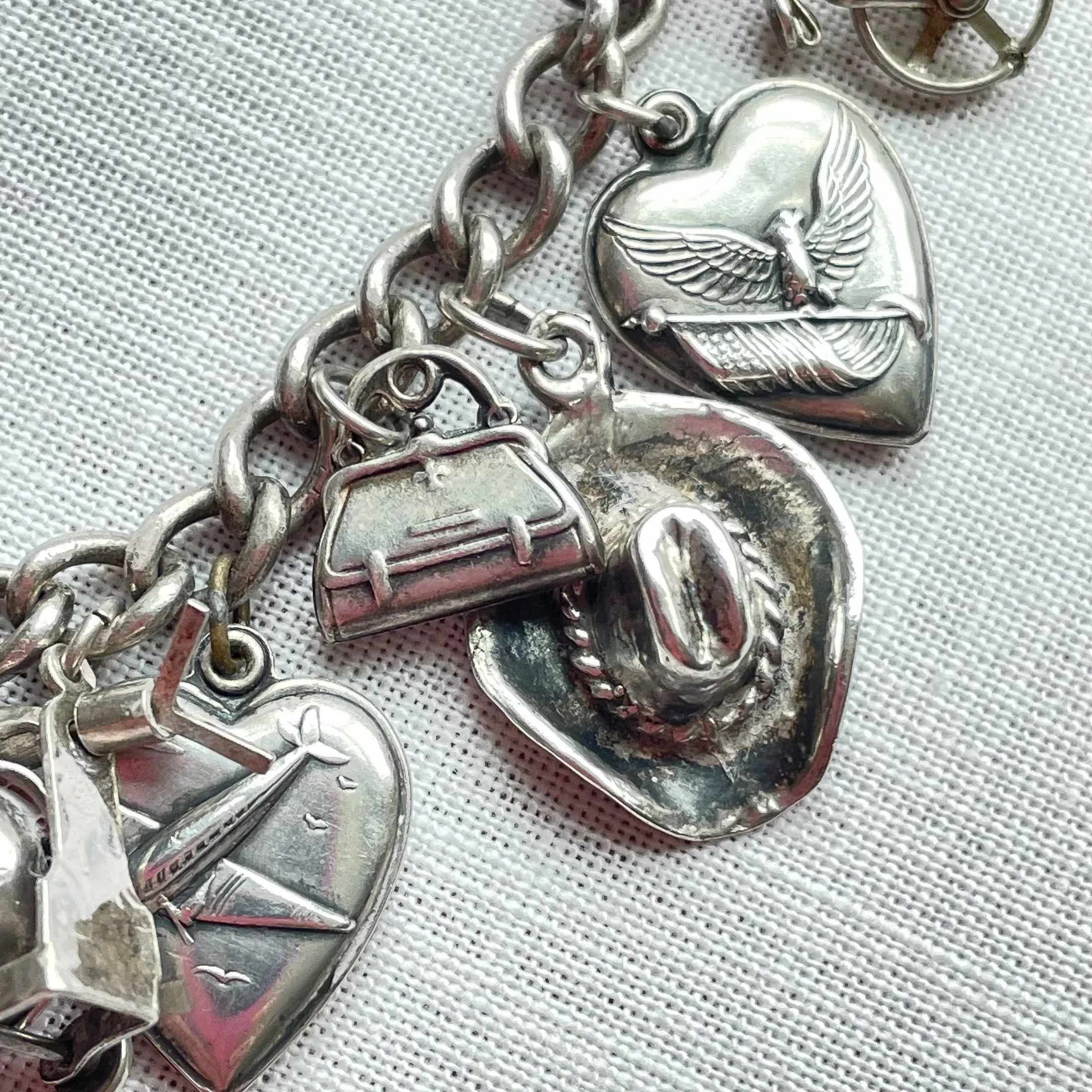 SOLD Vintage 40s WWII Sterling Charm Bracelet, Puffy Hearts/Southwestern/Calif/Military Sweethearts 22 Charms