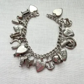 SOLD Vintage 40s WWII Sterling Charm Bracelet, Puffy Hearts/Southwestern/Calif/Military Sweethearts 22 Charms